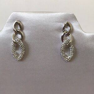 New silver tone earrings with Crystals.